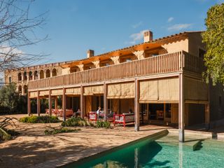 Circular Additions and a Triangular Atrium Turn a Generic Spanish Home Into a Personal Paradise