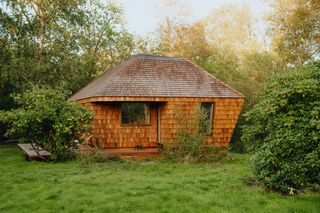 A 10-Person Sauna Somehow Fits in This Tiny Summer House in Denmark—and Converts Into a Bedroom