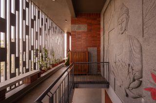This Family’s "Minimalist" Home Includes a Curlicue Window Seat and a Half-Ton Buddha