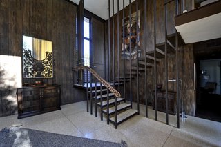Follow in the footsteps of Steve as you take the stairs either down to the living space and pool or up to the bedroom... 