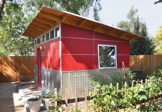 When a Colorado web designer’s newborn daughter moved into his home office, he relocated to this cool shed made of ruby-red Collins Truwood Siding and corrugated metal, just a few feet from the back door of his house.