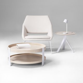 Pictured above, Coffee Table, $149.99; Side Table, $89.99; LED Task Lamp, $49.99; Lounge Chair, $249.99. Thinking of "a hybrid between a chair with no arms and a chair with arms," Deam explains, resulted in this lounge seat, which features steel legs and tall, foam-cushioned sides that comfortably cradle the user.