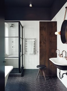 10 Ideas For the Minimalist Bathroom of Your Dreams - Photo 5 of 10 - This Montreal bathroom is all about the mix of materials, from industrial metals and reclaimed wood to clean, graphic tiles.