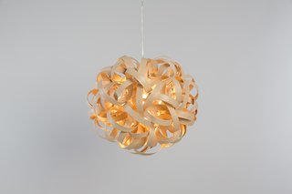 Approximately 262 feet of wood go into the making of Terence Woodgate's No.1 pendant, which is made by hand with sustainably sourced wood. The industrial designer launched his eponymous lighting company in 2014.