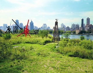 The park, newly transformed into a public art space in 1986. Mark di Suvero's red-painted steel sculpture, "Old Glory," is one of the pieces pictured.