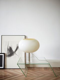 There are three versions of the table lamp, each with a slightly different size and profile. A specific color is designated for each—brown, gray, or bamboo green—and white is an option for all three.