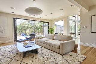 Solid white oak flooring is installed throughout. The home's windows and doors are by Andersen Windows.