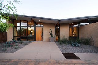 The Montecito residence—designed by Kristine Woolsey, now of MAYA Design—is yet another home we'll be sharing. Working with a midcentury gem that the homeowners wished to preserve, Woolsey updated it in ways that would make it more functional for a growing family. The first design decision they made was to embrace the existing butterfly roof and turn it into a thematic element.