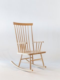 Today’s rendition of the Rocking Chair, shown here in the natural ash finish, relies on its clean lines and meticulous craftsmanship.
