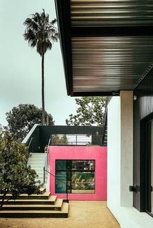 The Power of Color and What Each Shade Is Best For - Photo 8 of 11 - When collaborating with the homeowner on this project, Rudin referenced the case study houses of Southern California as well as the eclectic and experimental architecture of the ‘70s and ‘80s. He utilized vertical metal siding and bright colors to define spaces marked by art.