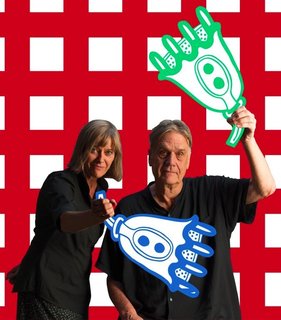 Nathalie Du Pasquier and George Sowden are shown here holding a pair of wacky props that imitate a motif that can be found in the textiles. 
