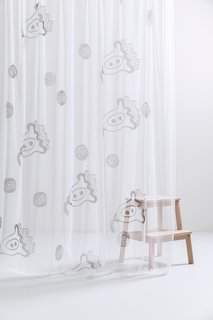 Also part of the CoopDPS collection are printed draperies that are made with an Italian woven tulle fabric. Shown here is the Provence curtain, which is inspired by the props that Pasquier and Sowden are waving in their portrait above. 