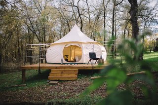 The Schulman yurt fits three adults with a queen bed and a pull-away bed. It comes with heating and bath essentials. 
