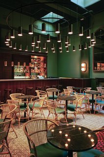 Hovering over the Libertine bar/restaurant in Casa Bonay is a massive lighting installation by Santa & Cole. As a Barcelona-based company that focuses on industrial design, they also provided the lighting throughout the rest of the hotel.