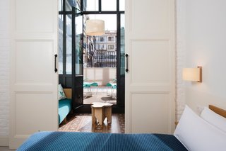 The floors of the guest rooms are still covered with the original mosaic tiles. The blankets in the rooms were handcrafted by Teixidors, a nonprofit company based outside of Barcelona that provides opportunities for individuals with learning disabilities.