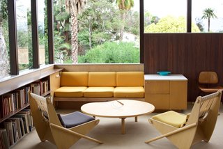 The collection of books in the upstairs living/dining room (shown here) have remained over the years and visitors are welcome to peruse them with care. Some of the furniture that lives in the residence today was built for the Lovell Health house that Neutra designed in 1929. The pair of Boomerang chairs came from a design Neutra created in the 1940s for Channel Heights, a residential development for shipyard workers in San Pedro, California. Today, the chairs—along with the Low Organic table—are being authentically reproduced by German manufacturer VS. Today’s design has been refined by his son Dion. 