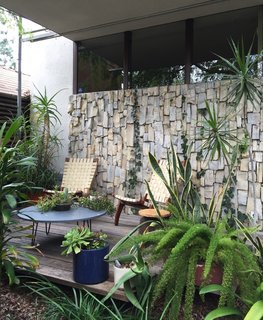 Like many modernist houses in Southern California, the courtyard was one of the most cherished locations and helped bring together both sections of the house with a pocket garden. Even after being cut 15 years ago, ivy plants continue to spread and shield the house from intense sun exposure. 