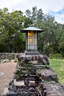 The gardens and ponds throughout the property are consistently kept up. To accommodate a eucalyptus tree that existed on the land before the house was built, the Greenes created notches in the roof line where it could stand.