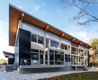 Bringing the Outdoors in Becomes a Reality for a Lakeside Retreat - Photo 1 of 2 - At the top of homeowner Bob Dahl’s wish list was a shed roof, applications of industrial materials, and tons of glass. Courtesy