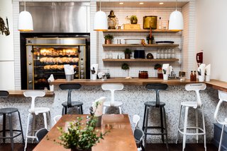 When you first walk into Souvla, your eye is drawn to the fully-operating rotisserie. A number of the Grecian objects displayed on the shelves were from the owner’s Grandfather’s restaurant in Boston. 