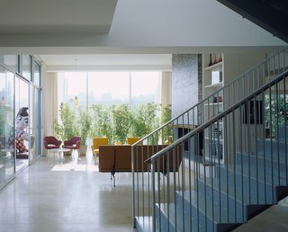 Dwell Home Tours Makes its Way to Portland - Photo 6 of 17 - The interior features French limestone floors, glass mosaic wall tiles by Ann Sacks, and sliding glass doors from Kawneer. 