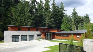 Dwell Home Tours Makes its Way to Portland - Photo 15 of 17 - Olson equipped the structure with a combination of concrete, metal, and wood. He turned to Elmwood Reclaimed Timber to source the solid reclaimed wood beams from Kansas. Jonathan Laycock of Laycock Gardens was the landscape architect while Grove Hunt of Grove Development was the builder. 