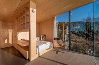 Each hut consists of two bedrooms with double beds, a small alcove, bathroom, shower, and small kitchen. Stinessen made sure to provide enough built-in storage for visitors, while also sticking to raw pine surfaces.