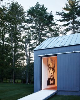Take a peek into the edge of the 19th-century barn that Ferris transformed into a gallery. The traditional barn structure was retained while the interior was turned into a minimal and open canvas for the current homeowner’s art collection. It’ll be interesting to see how the next owner utilizes the space. 