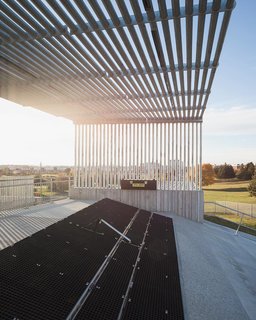 Ensuring that the ramp structure is both stable and elegant was a technical challenge for KMA Inc. James C Lee's photo captures how the galvanized steel pipes form graphic shadows along the concrete foundation.