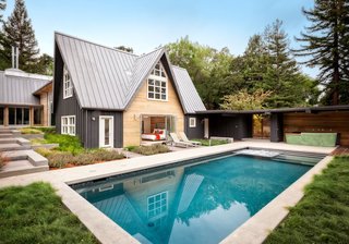 Dwell Home Tours Lands in Silicon Valley - Photo 1 of 15 - At the Dyson Residence, one of the A-frames (shown here) contains five bedrooms and looks out to a pool and outdoor bar. While one side of the house borders a tranquil creek, the other side sits alongside a nature preserve. 