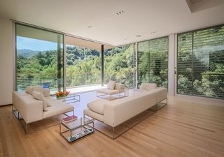 Dwell Home Tours Lands in Silicon Valley - Photo 5 of 15 - The ceiling and walls hide expanding foam insulation, while much of the space is lined with floor-to-ceiling glazed sliding doors. 
