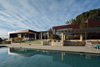 Dwell Home Tours Lands in Silicon Valley - Photo 9 of 15 - Shown here is the 85-foot-long infinity-edge pool and the outdoor terraces that take advantage of the temperate climate. This setup reveals how important an indoor/outdoor lifestyle is to the residences of this region. The landscape was outfitted by Jack Chandler Landscape Design. 