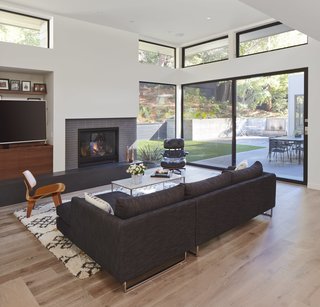 Dwell Home Tours Lands in Silicon Valley - Photo 14 of 15 - Williamson strategically placed the windows and clerestories to maximize daylight. A fireplace provides a warming focal point. 