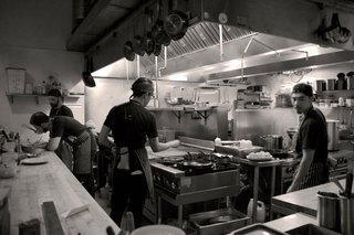The tavern-like restaurant is dark and moody, while the open kitchen lights up the space from the corner. We spent some time watching the bustling team piece together their creations.