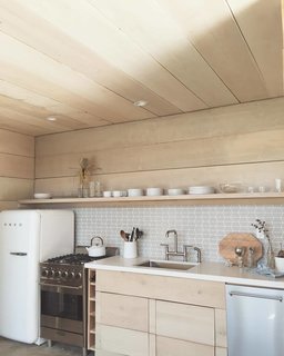 His backyard fort now has a kitchen and is filled with a ton of cedar and a mix of different calming textures that reflect his beach house-vibe.