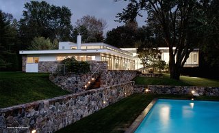 Marcel Breuer’s Revived Home Could be Yours for Just Under $5 Million - Photo 1 of 8 - The Breuer property sits on three acres and includes a heated pool, pool house that was originally designed in 1981, sunning deck, and a Mori-designed wine cellar. The terrace features a waterfall and fern garden.