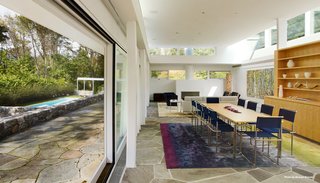 Marcel Breuer’s Revived Home Could be Yours for Just Under $5 Million - Photo 3 of 8 - Listing agent Sherri Kielland explains that in order to preserve the radiant heated floor, she chiseled the original floor off while cataloging all the stones. After laying down the new radiant heated bluestone floors, she pieced it back together like a puzzle. She also dug a well under the kitchen area to house the mechanicals of the house.