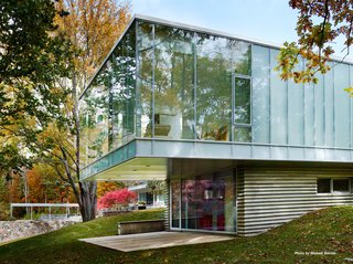 Marcel Breuer’s Revived Home Could be Yours for Just Under $5 Million - Photo 6 of 8 - Mori's addition is constructed of steel, concrete, glass, and a bluestone veneer. She decided to preserve the ceiling height of the main house (11'6") and lined the roof with Voltaic solar panels.