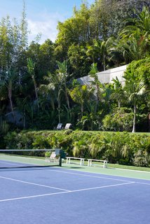 The colossal yard includes L.A.’s only infinity tennis court and looks out to astonishing views. Goldstein mentioned that you can see all the way out to Catalina Island on a clear day.