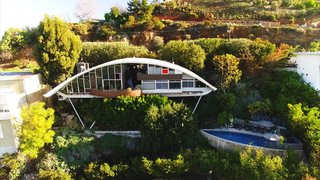 John Lautner’s Garcia House stands on stilts 60 feet above the canyon on Mulholland Drive in Los Angeles. When John Mcllwee and Bill Damaschke purchased the residence in 2002, they began a journey to bring the masterpiece back to life after being passed around by multiple owners since its creation in 1962. 