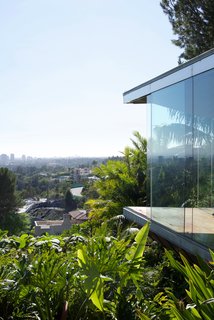 One of the first projects Goldstein and Lautner did together to renovate the house was implement seamless glass throughout the residence, which created a connection to the outdoors that remains consistent throughout the entire property. Many of the windows were updated to open automatically.