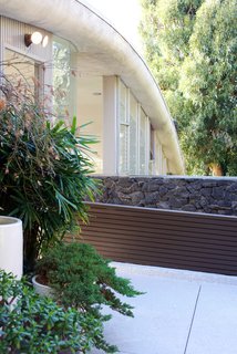 One of the most iconic elements of the home is the lava rock that was brought over from Hawaii. It still stands as one of the main structural elements.