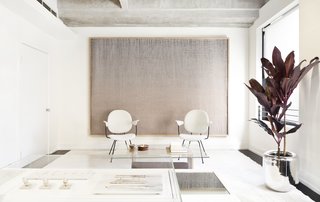 Shown here is the lounge/waiting area where customers can make themselves at home when they first enter. Early Work’s co-founder and artist Mimi Jung created the woven artwork that hovers over the space.