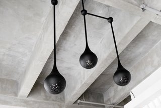 As the duo’s first experiment with lighting design, each pendant was spun by hand in L.A. and has a custom perforated pattern that allows light to shine through.