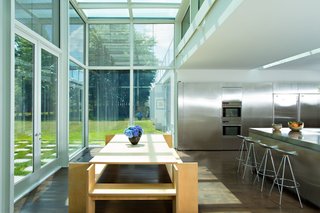 Adjacent to the reflecting pool is a chef's kitchen that’s filled with expanses of stainless steel.