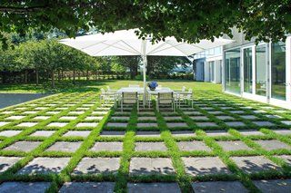 Dan Kiley filled the entire property with thoughtful landscape elements, including this patched concrete outdoor dining area. 