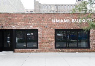 A Popular Burger Joint Flaunts Its Roots With the Help of a Design Collective - Photo 1 of 8 - As one of the new locations, the facade of the Chicago Umami Burger was left mostly untouched besides a simple, modern logo and dark black windows that help keep the mystery alive.