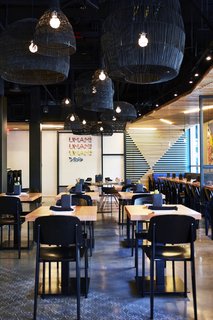 A Popular Burger Joint Flaunts Its Roots With the Help of a Design Collective - Photo 3 of 8 - At the new Santa Monica locale, they took cues from Ruth Asawa—the legendary Japanese-American sculptor—by scattering woven Nama pendant lanterns by Ay illuminate.