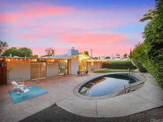 The bean–shaped pool and small grassy area would allow you to enjoy the Southern California climate year-round.