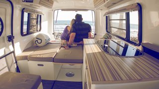 This California–Made Camper Is All You Need to Get Your Adventures Going - Photo 2 of 7 - Inside, you can choose a built-in kitchenette in a number of sizes and setups. The interior is also lined with multiple storage areas, while the foundation is made up of a solid honeycomb fiberglass material. 